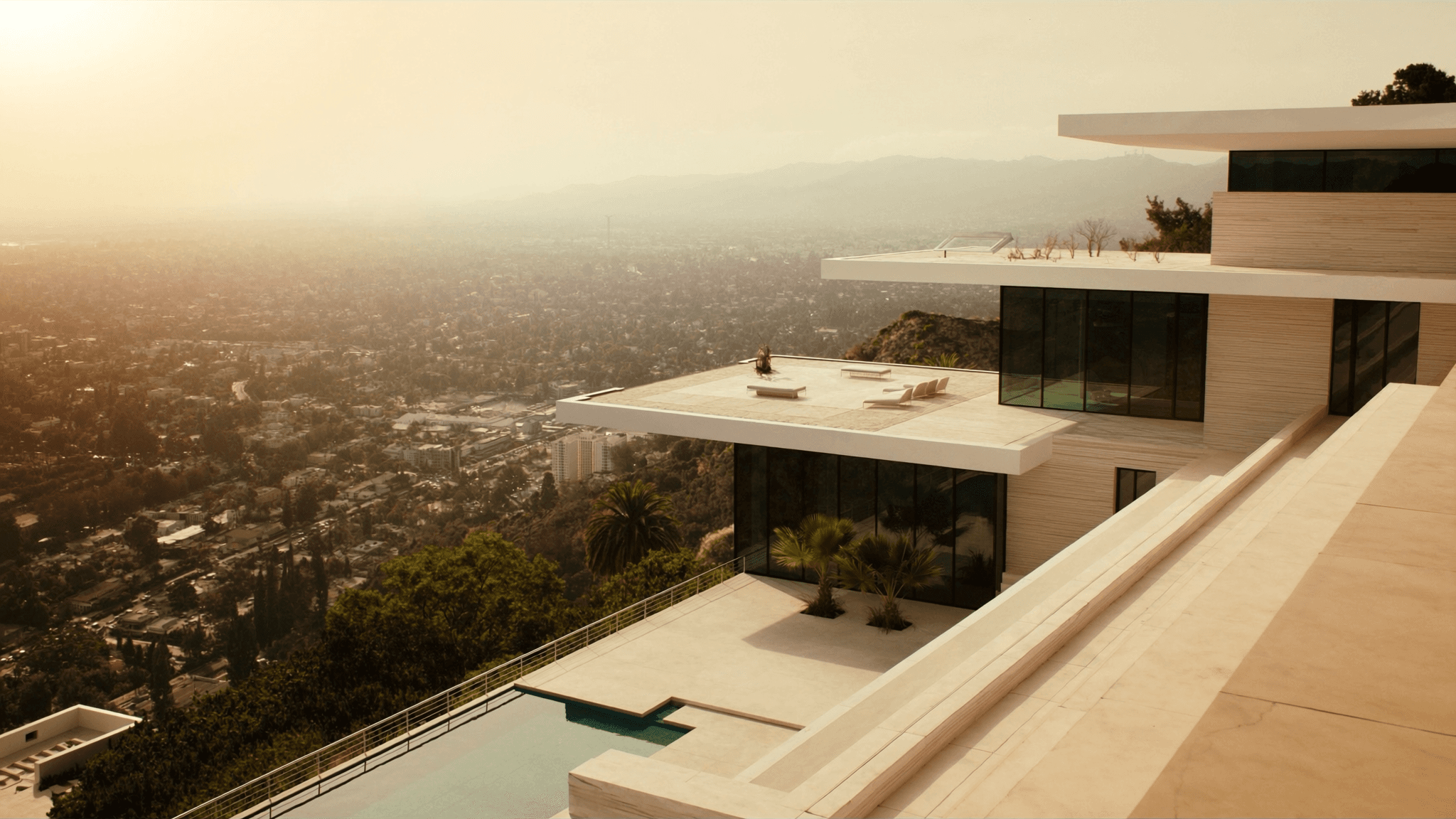 Modern luxury estate overlooking Los Angeles at golden hour