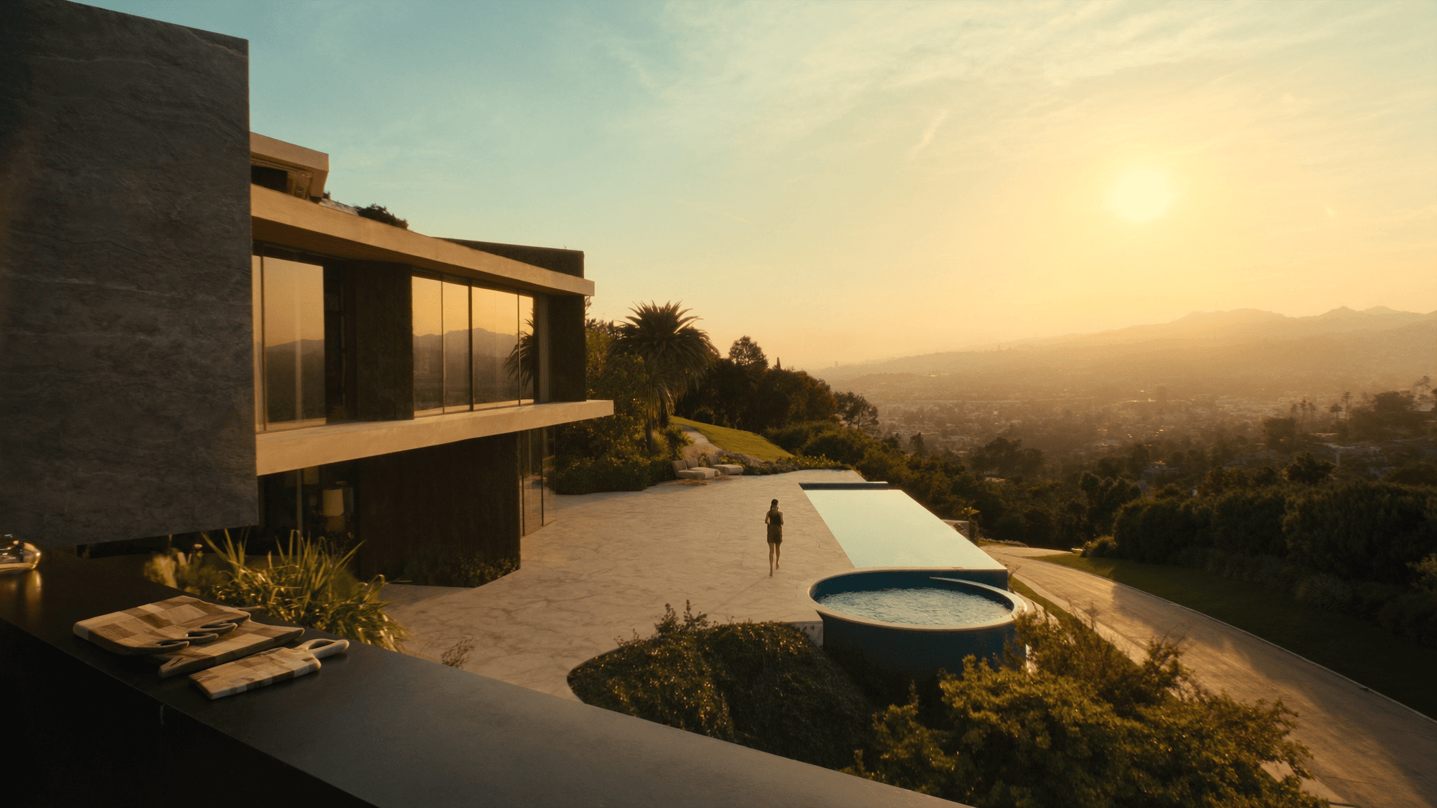 Modern Los Angeles hillside estate with infinity pool at golden hour